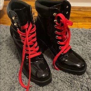 Black patent leather booties with red laces